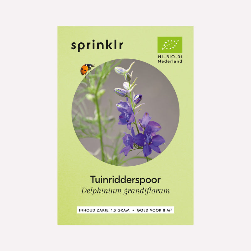 Voorkant zakje biologisch zaad Sprinklr - Tuinridderspoor